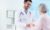 young-doctor-supporting-his-patient_1098-2237